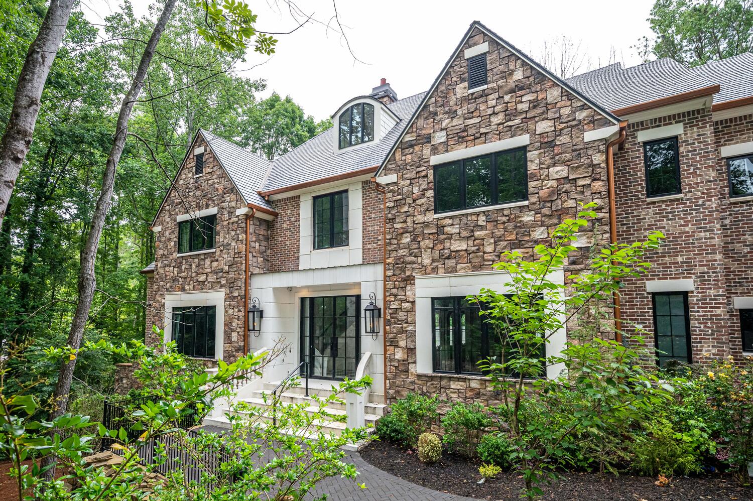 Stone and brick exterior of a designed short-term rental in Atlanta, Georgia